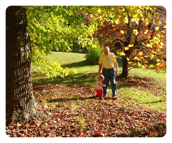 Grandpa and Lily walking in the backyard