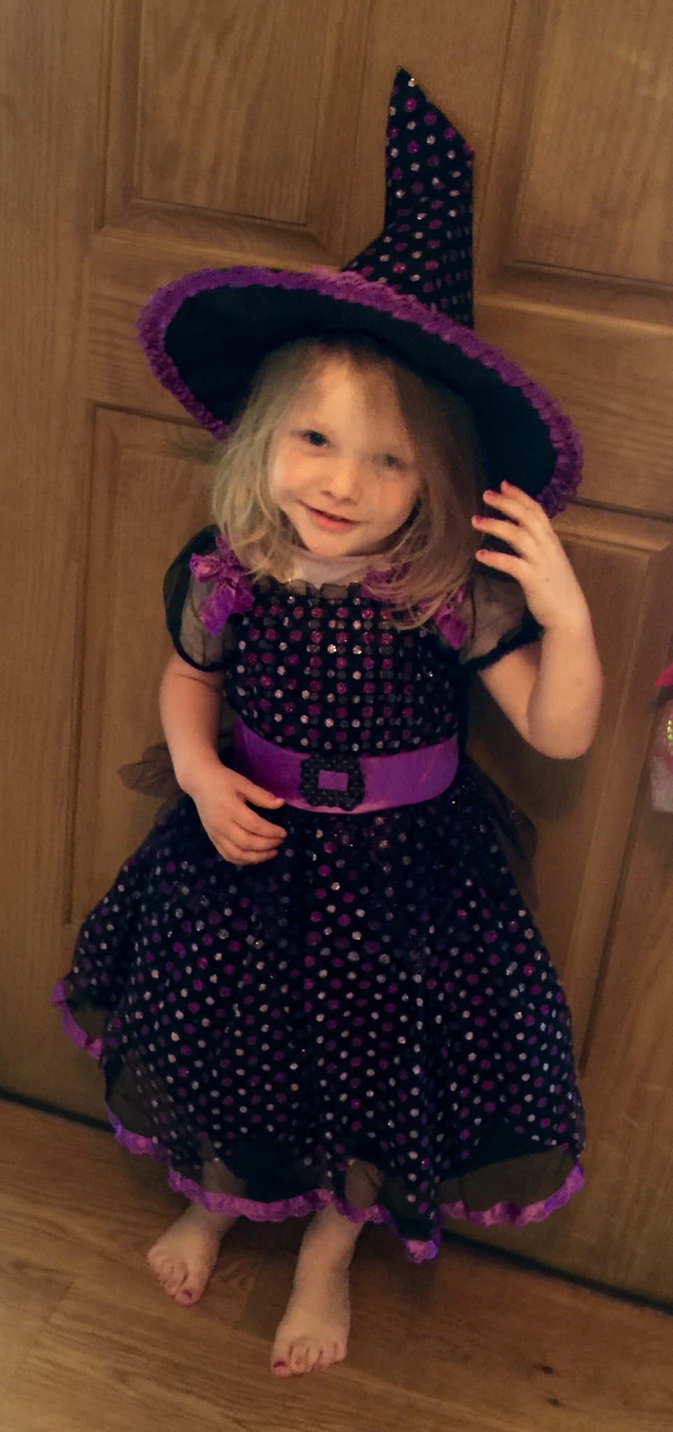 Lily is trying on her Halloween outfit