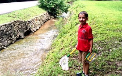 Nothing makes Daniel smile quite like a good creek!