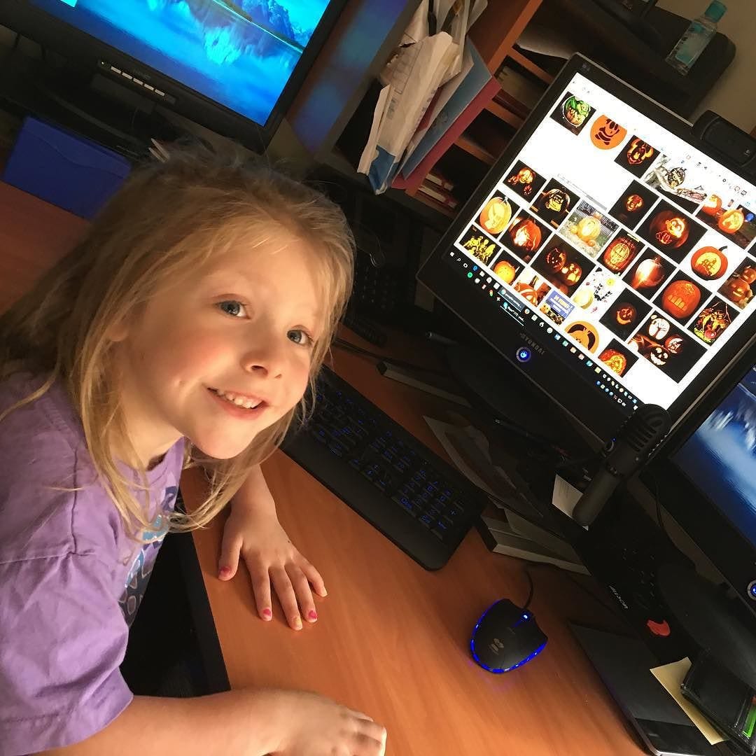 Lily picking out her pumpkin pattern for Halloween.